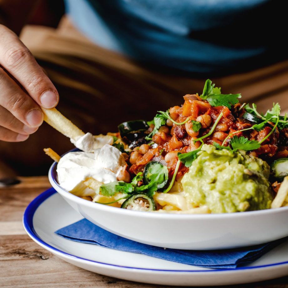 Dipping a chip bowl of food at at the george pub in tunbridge wells