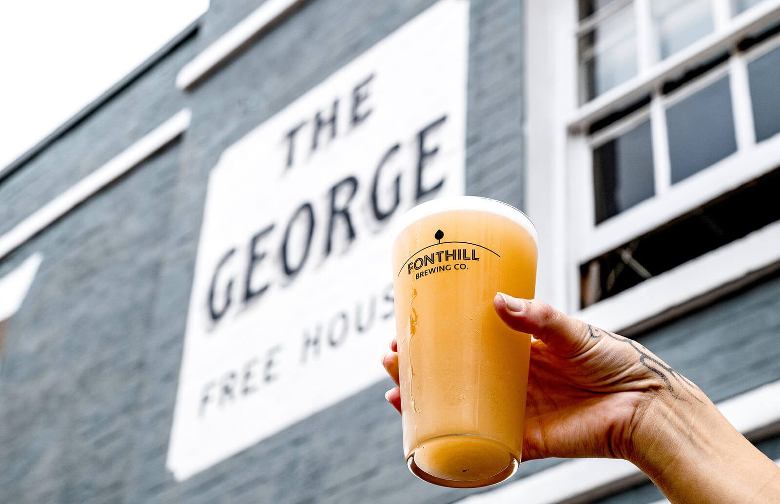 A pint of local craft beer served in a beer glass, at The George pub in Tunbridge Wells