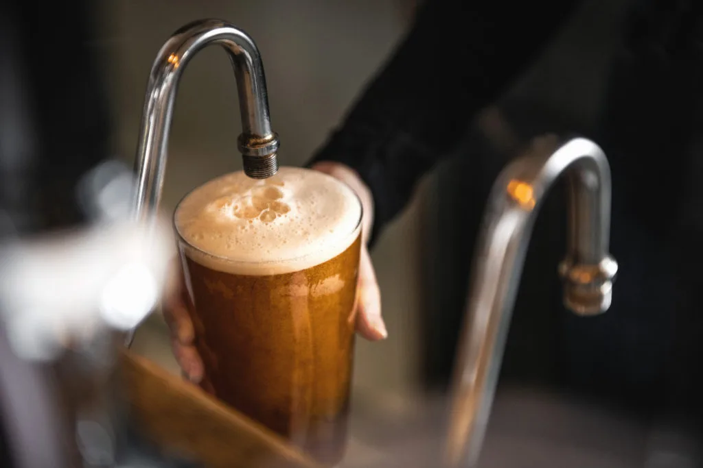 Dark beer poured at The George pub in Tunbridge Wells