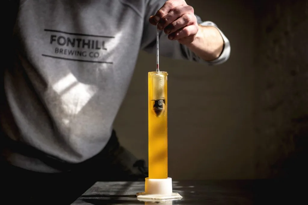 Fonthill Brewing Co's brewer testing for gravity